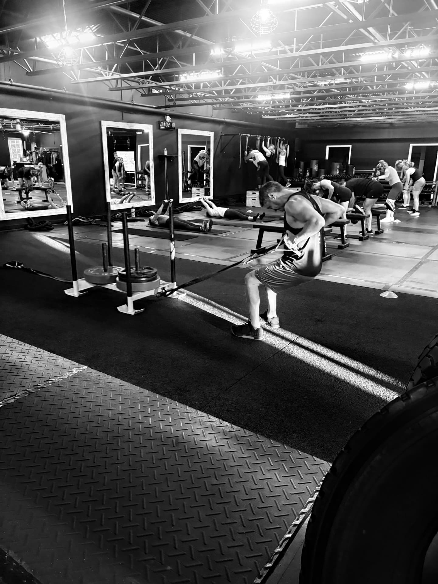 Fitness Artist members training on the floor during a session